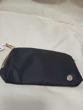 lululemon athletica black wristlet clutch with gold zipper